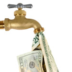 Water tap dripping dollar bills, Water waste concept